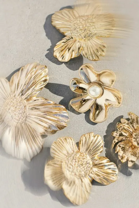 Gold blossom hair clips laid out