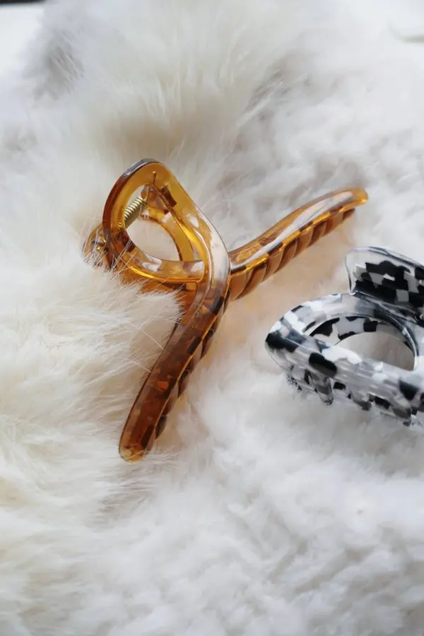 Tortoise and marble claw clips on a fluffy rug